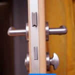 wooden door with silver doorhandle at home