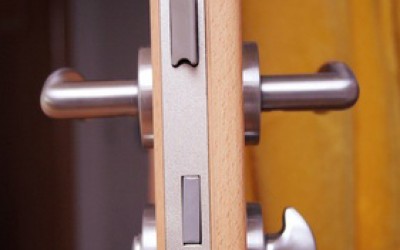 wooden door with silver doorhandle at home